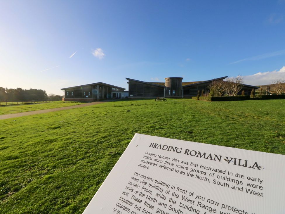 A view of Brading Roman Villa with a sign in the foreground at 63 Crosswinds, Bembridge