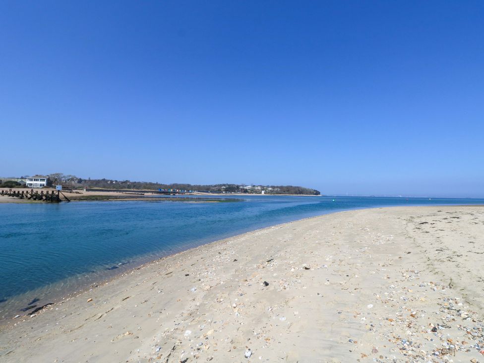A beach scene with sand and water at 63 Crosswinds in Bembridge