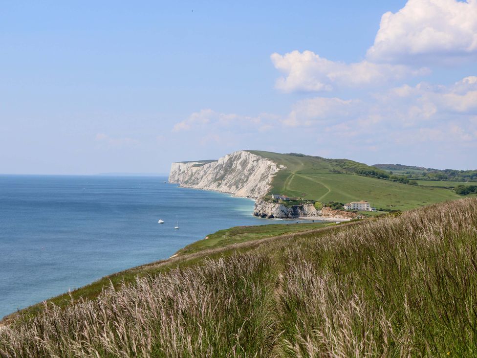 A coastal landscape featuring cliffs and the sea at 63 Crosswinds Hillway near Bembridge