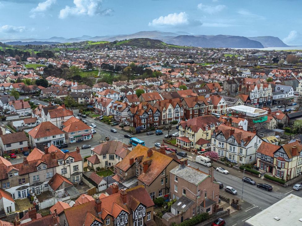 An aerial view of residential area with houses and roads at The Causeway in Llandudno