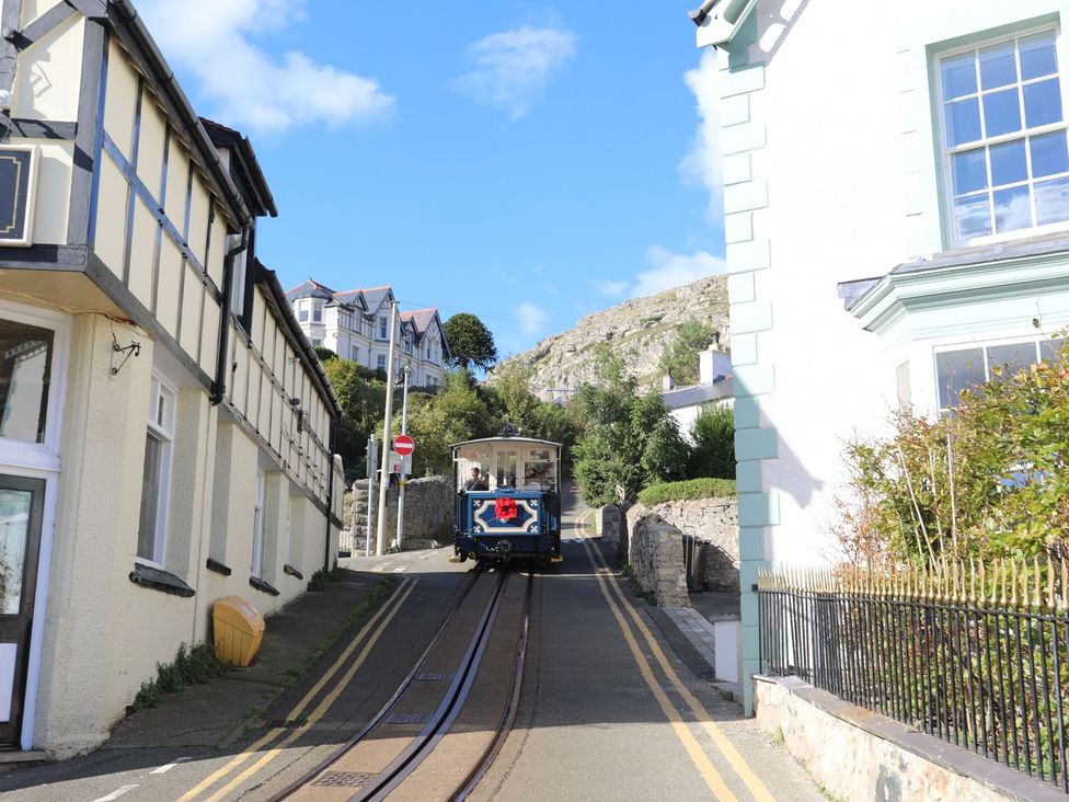 A street with a trolley on tracks at The Causeway in Llandudno
