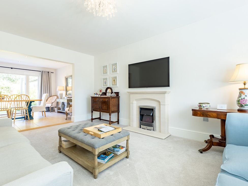 A living room with a sofa and television at Old Railway Close in Lechlade-On-Thames