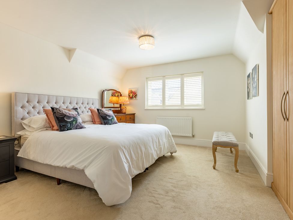 A bedroom with a bed and bedside table at Old Railway Close in Lechlade-On-Thames