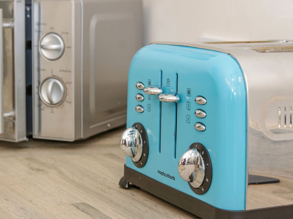 A toaster and microwave in a kitchen at Eryri View Retreat