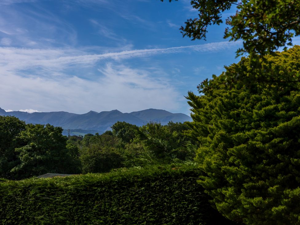 A view of mountains and trees at Eryri View Retreat Llangoed near Beaumaris