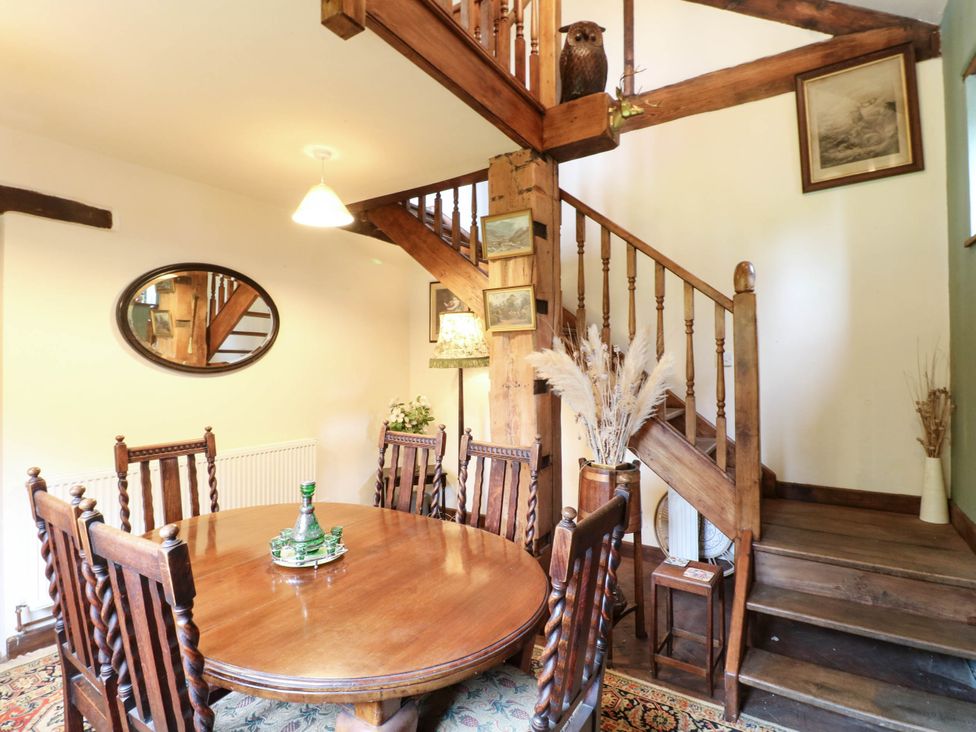 A dining room with a table and chairs at The Barn in Tamworth