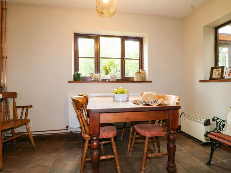 A dining room with a table and chairs at The Barn in Tamworth