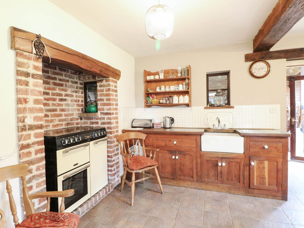 A kitchen with an oven and sink at The Barn in Tamworth