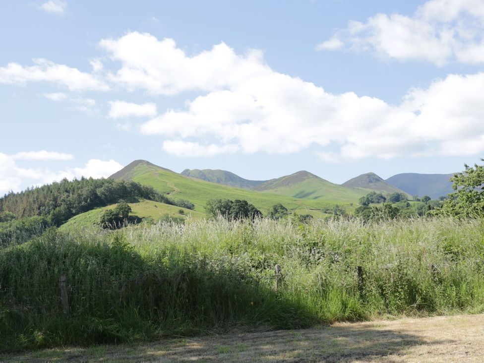 A view of mountains and grass in the outdoors at Cottage 1 in Braithwaite