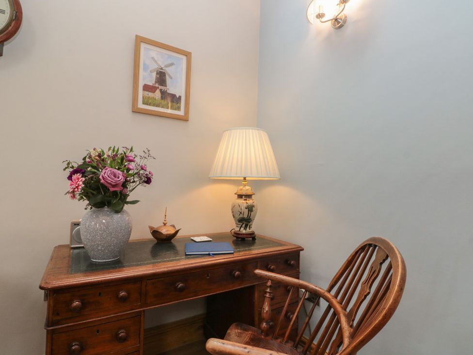 An office with a desk and chair at Bumble Bee Lodge in Filey