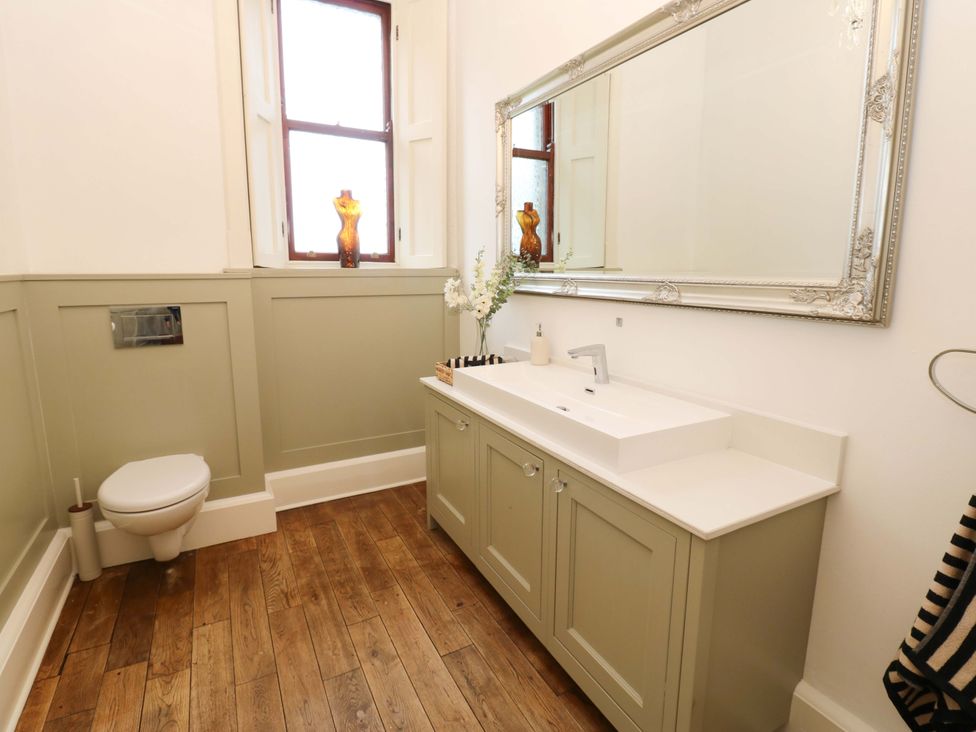 A bathroom with a sink and toilet at Flaxstead Grange in Newbottle