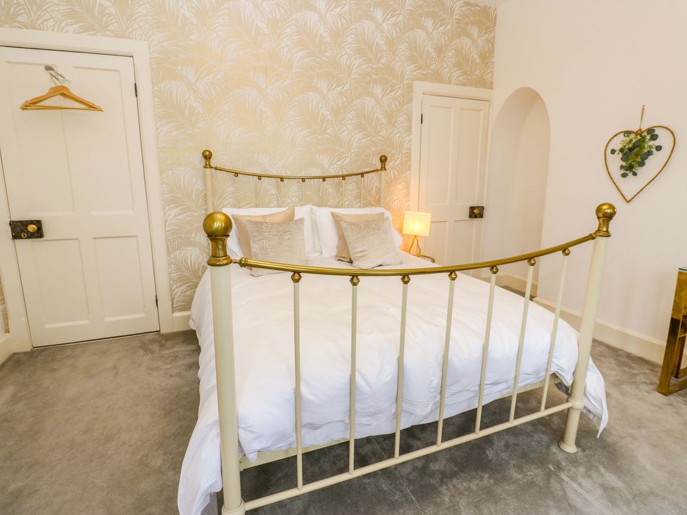 A bedroom with a bed and lamp at Flaxstead Grange in Newbottle