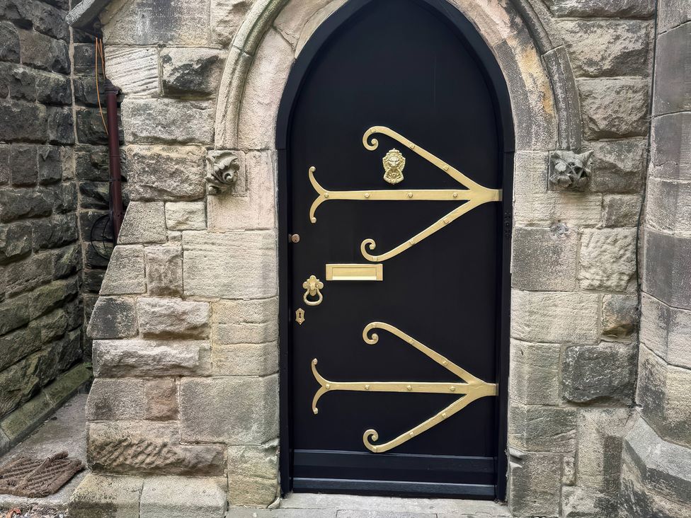A decorative door with metal accents at Flaxstead Grange in Newbottle