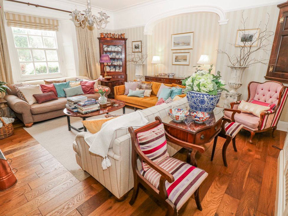 A living room with sofas and a coffee table at The Old Vicarage in Carmarthen