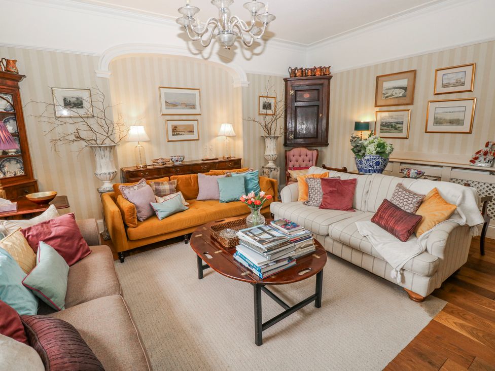 A living room with sofas and a coffee table at The Old Vicarage in Carmarthen