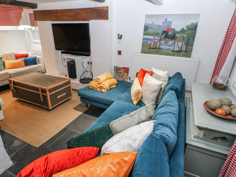 A living room with a sofa and coffee table at The Old Vicarage in Carmarthen