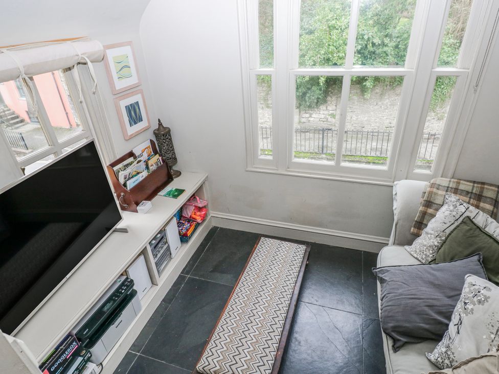 A living room with a television and a sofa at The Old Vicarage in Carmarthen