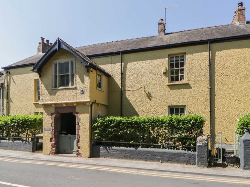 A house with a door and windows on the street at The Old Vicarage in Laugharne