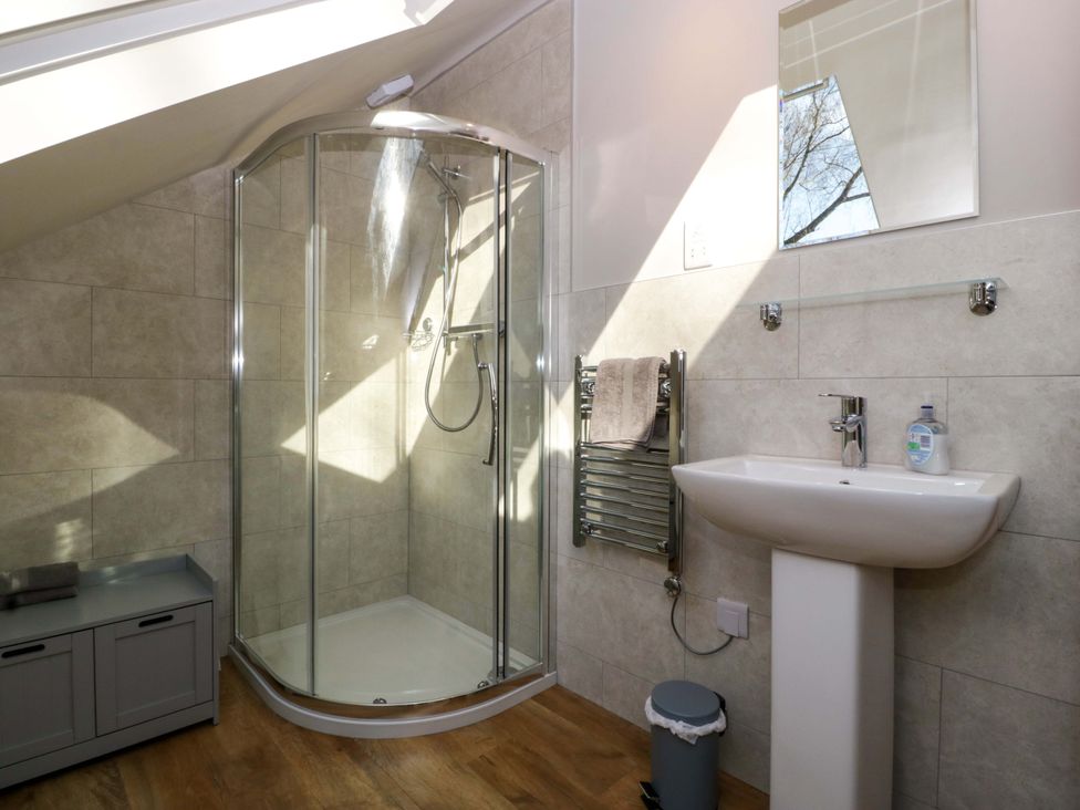 A bathroom with a shower and sink at Broadmoor Chapel in Hereford