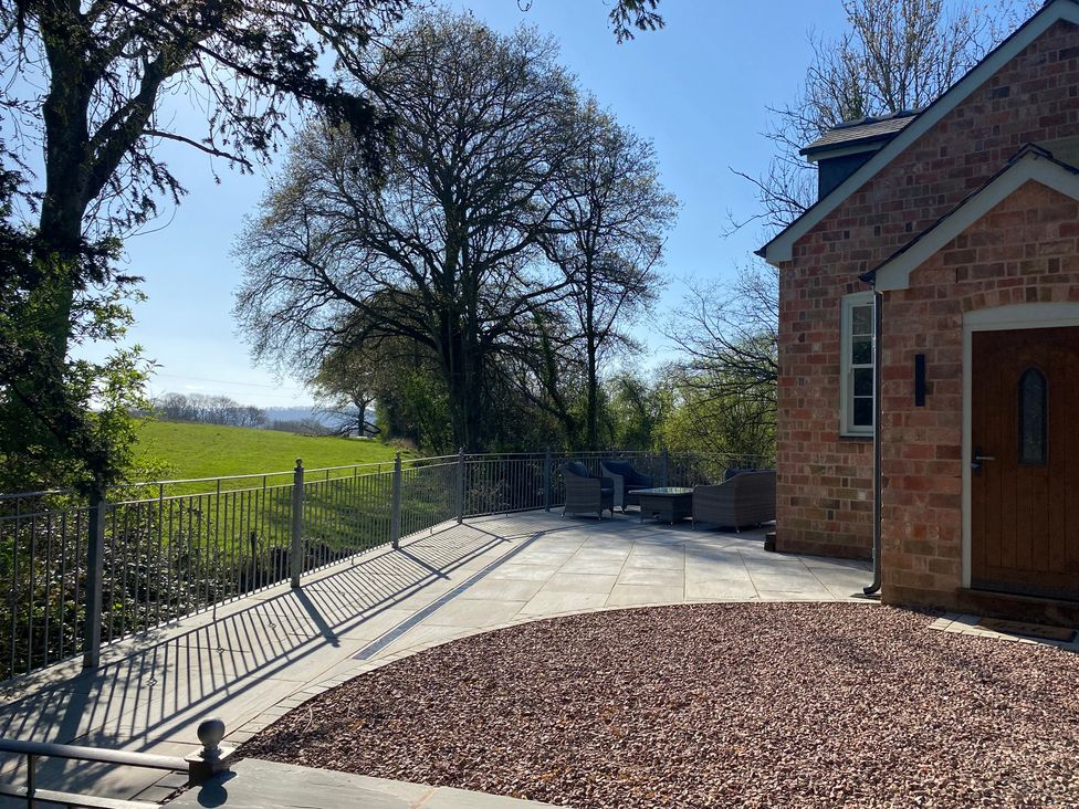 An outdoor patio area with seating at Broadmoor Chapel in Hereford