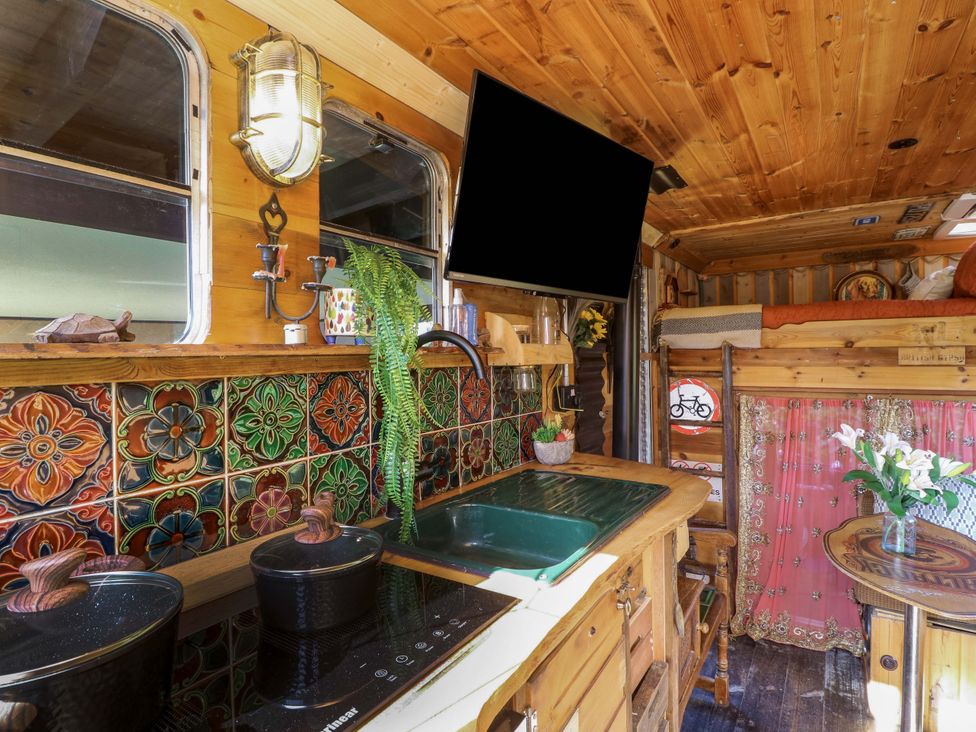 A kitchen with a sink and induction cooktop at Old Rosie in Grantham