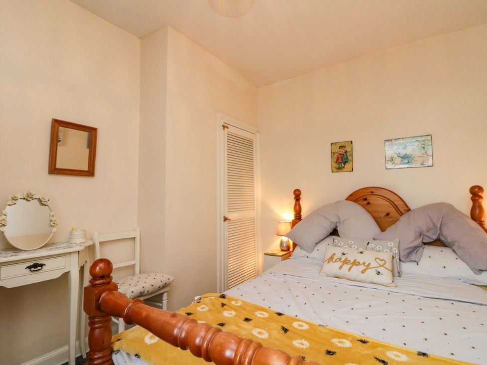 A bedroom with a bed and small table at 46 Nelson Street in Bridlington