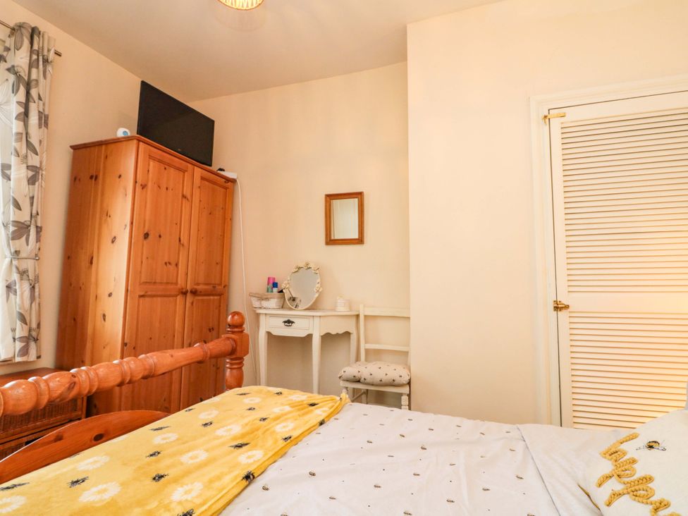 A bedroom with a bed and wardrobe at 46 Nelson Street in Bridlington