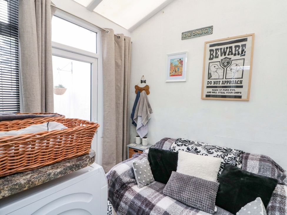 A snug with a sofa and a basket at 46 Nelson Street in Bridlington