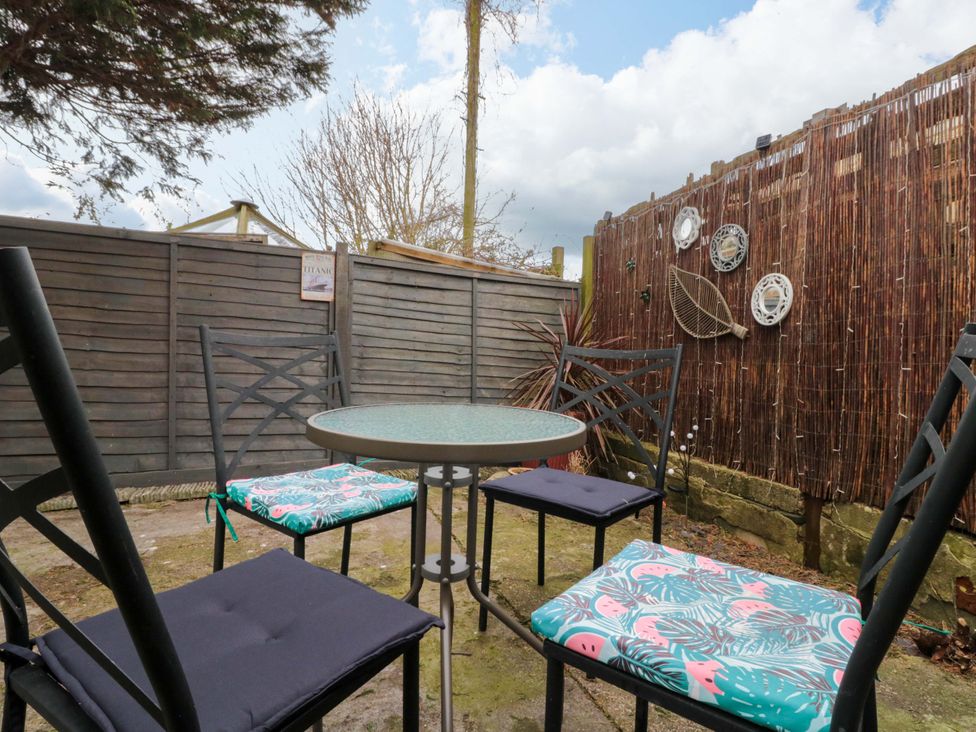 A garden seating area with a table and chairs at 46 Nelson Street Bridlington