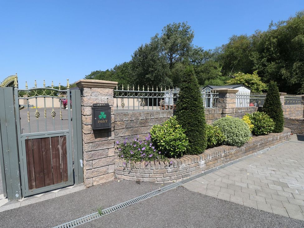 An entrance with a gate and mailbox at Annexe @ Meadows Farm in Gorseinon