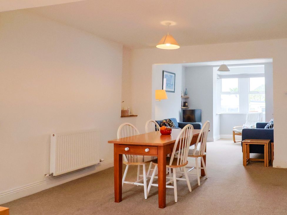 A dining room with a table and chairs at 4 Peaslands Road Sidmouth
