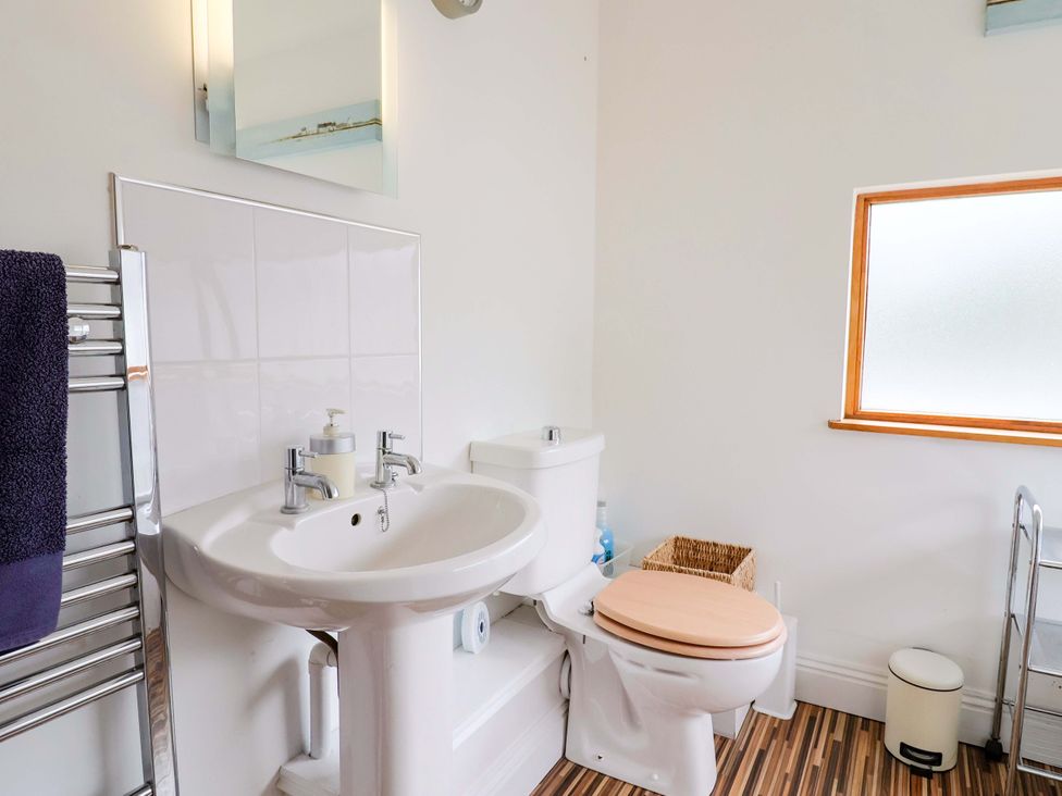 A bathroom with a sink and toilet at 4 Peaslands Road Sidmouth