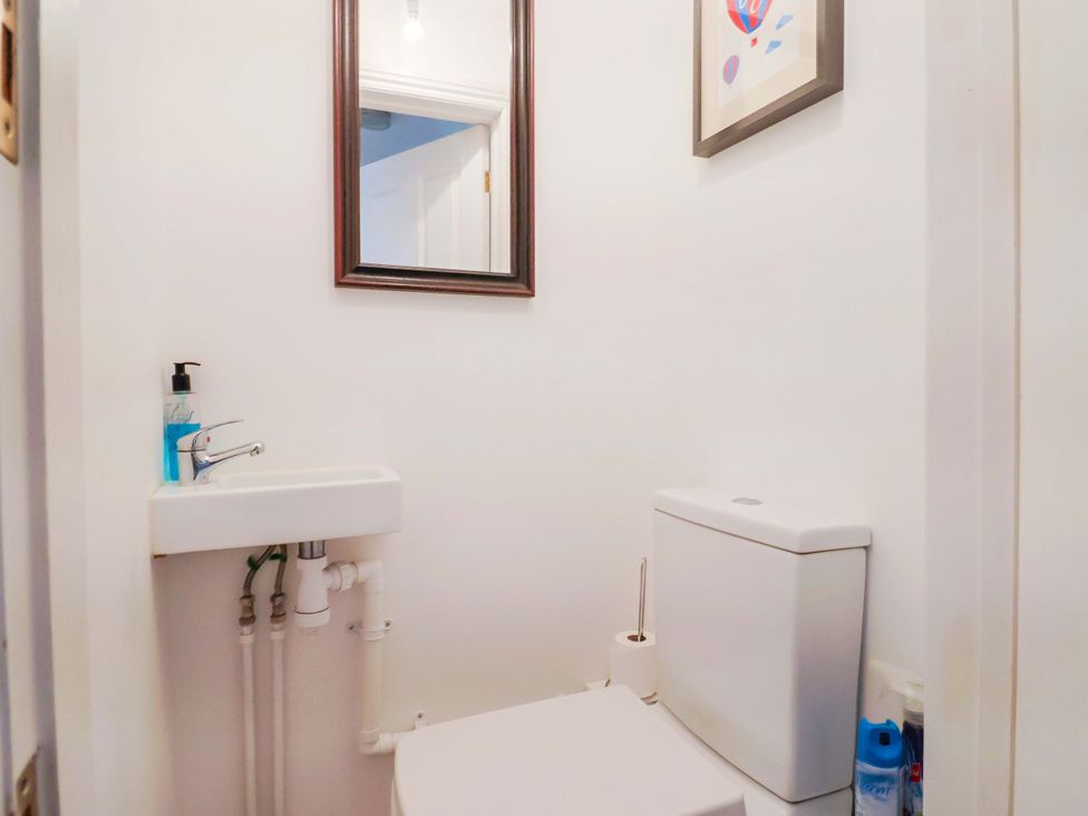 A bathroom with a sink and a toilet at 4 Peaslands Road Sidmouth