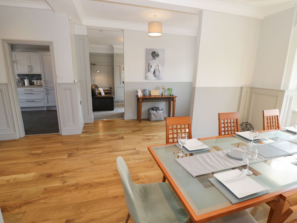 A dining room with a table and chairs at 141 Barnards Green Road, Barnard's Green, Malvern
