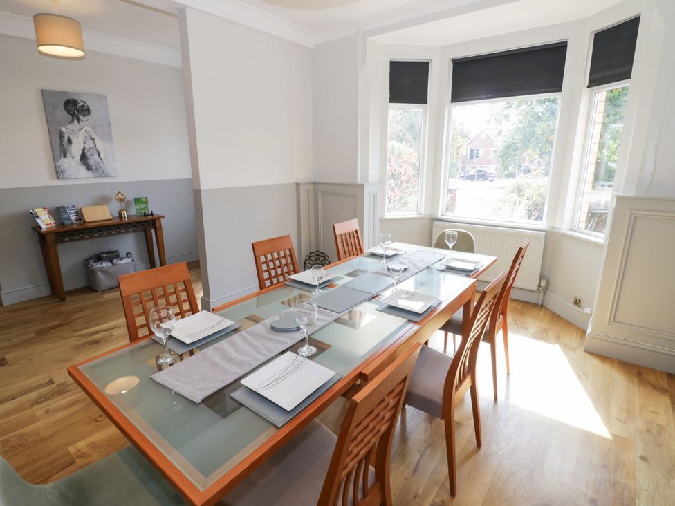 A dining room with a table and chairs at 141 Barnards Green Road in Barnard's Green, Malvern