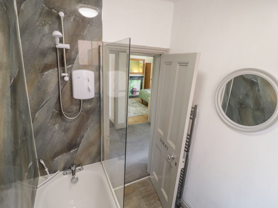 A bathroom with a shower and bathtub at 141 Barnards Green Road in Barnard's Green, Malvern