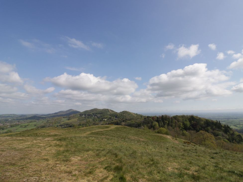 A view of hills and fields under a cloudy sky at 141 Barnards Green Road, Barnard's Green, Malvern