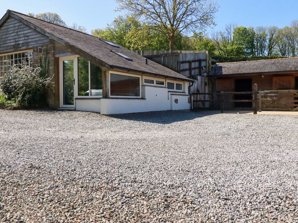 An outdoor view of a building with gravel landscaping at Millies Place in St Austell