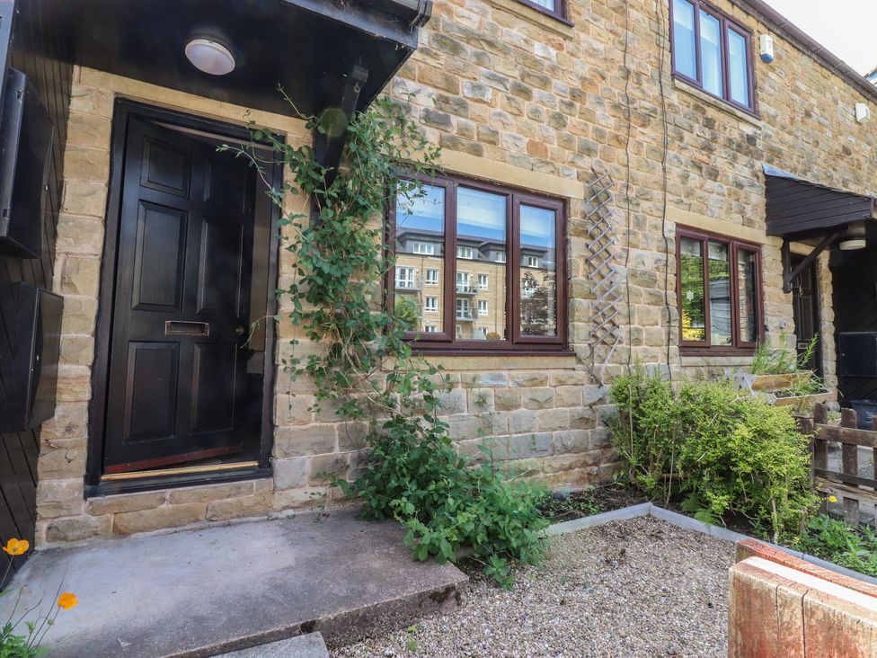 An entrance area with a door and windows at 9 Waterside Fold Hebden Bridge