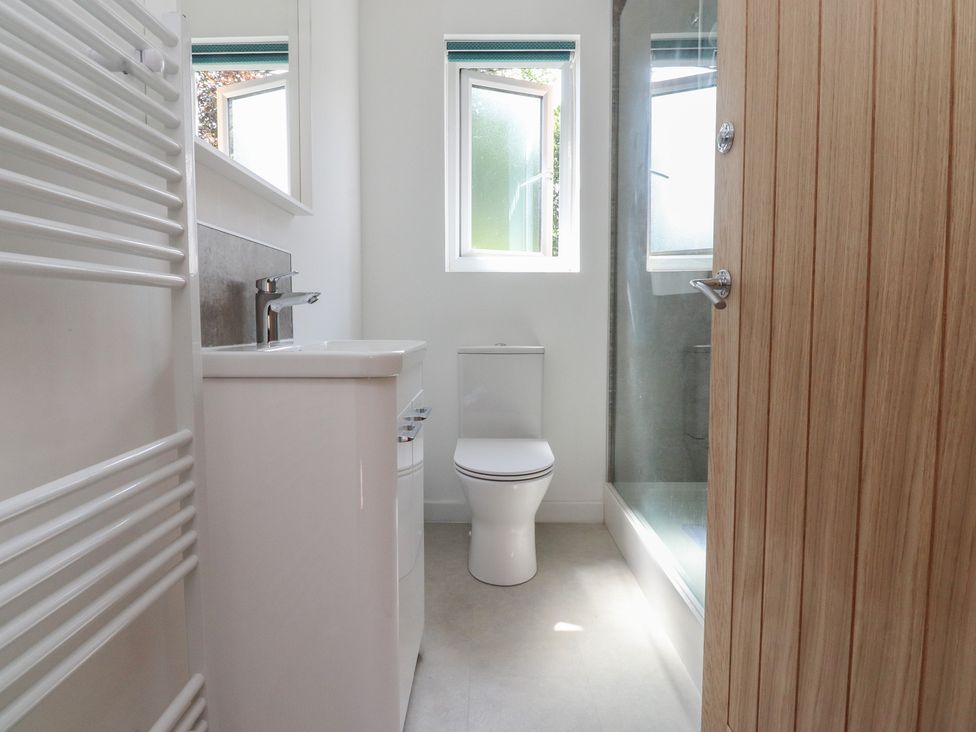 A bathroom with a sink and toilet at 9 Waterside Fold Hebden Bridge