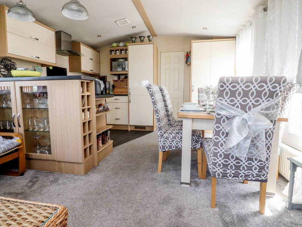 A kitchen with dining area at 33 Pendle View in Clitheroe