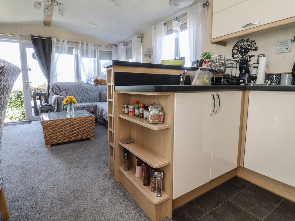 A living room with a sofa and coffee table at 33 Pendle View in Clitheroe