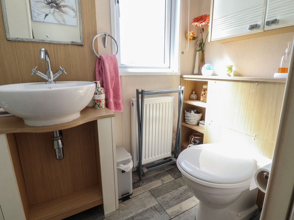 A bathroom with a wash basin and toilet at 33 Pendle View in Clitheroe
