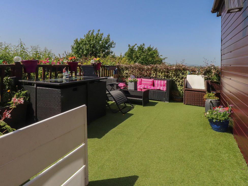 A terrace with outdoor furniture and plants at 33 Pendle View Clitheroe