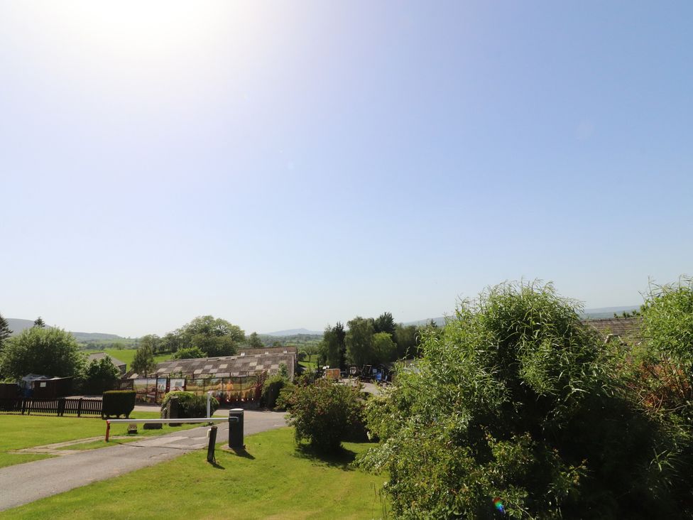 Outdoor view with trees and buildings at 33 Pendle View in Clitheroe