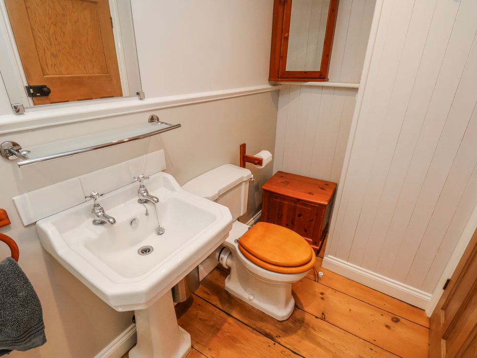 A bathroom with a sink and toilet at Holly Cottage in Whitby