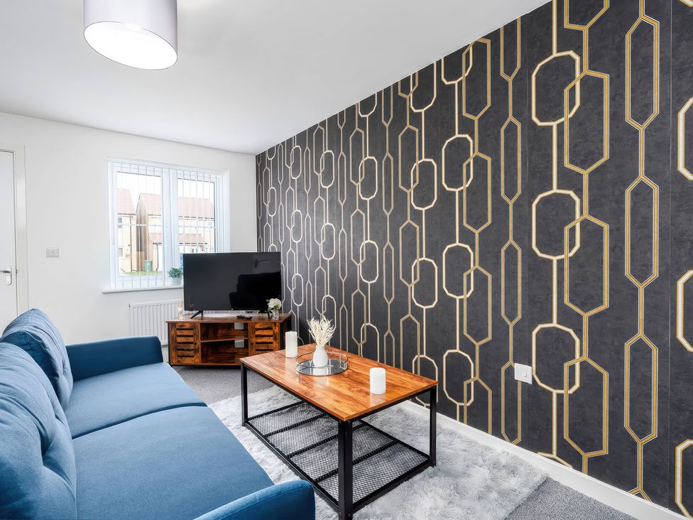 A living room with sofa and coffee table at 59 Eagle Drive in Grimsby