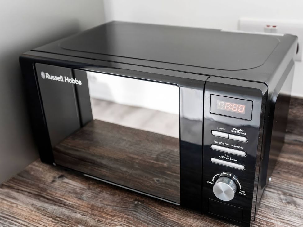 A microwave on a countertop at 59 Eagle Drive in Grimsby