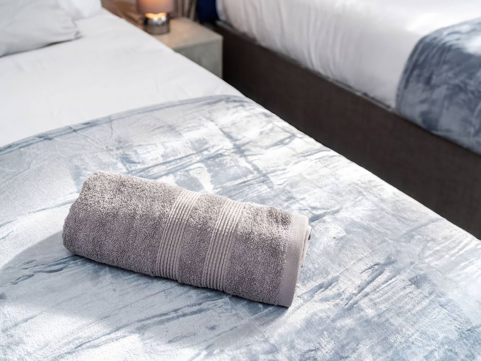 A towel on a bed at 59 Eagle Drive in Grimsby