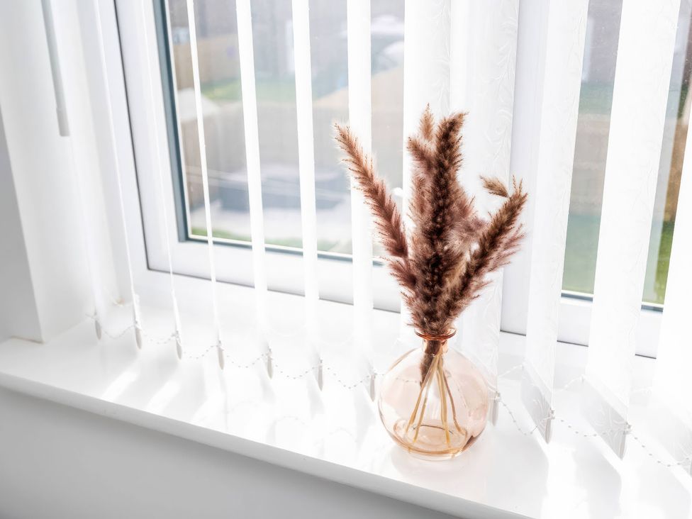 A window with pampas grass in a vase at 59 Eagle Drive in Grimsby